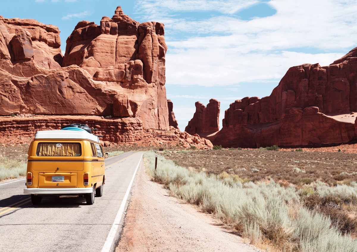 Open scenic road under expansive sky symbolizing retirement relocation choices between states